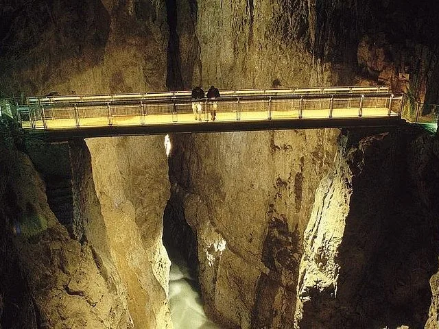 People standing on a bridge inside the Skocjan Caves, Slovenia