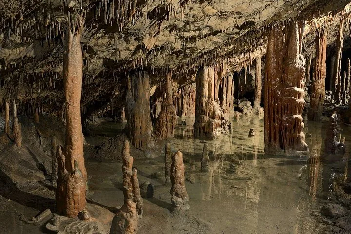 Stalagmites and stalactites inside a large limestone cave